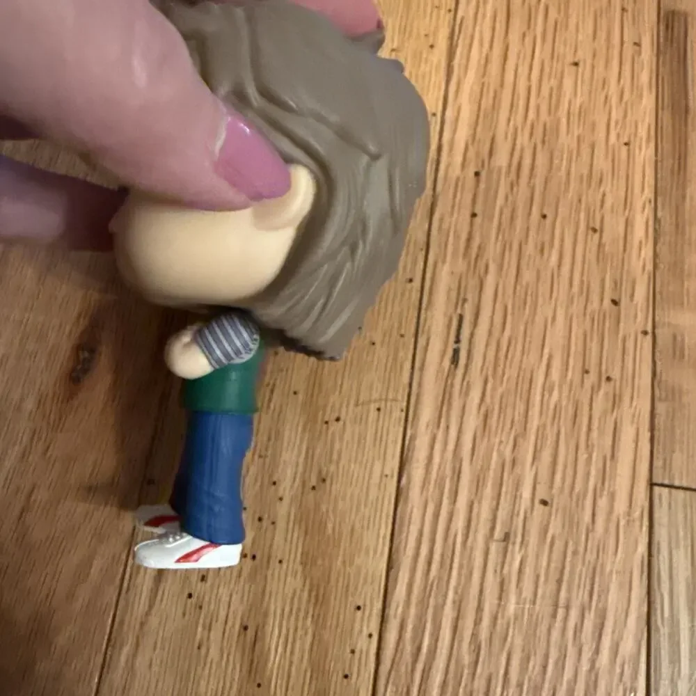 Funko Pop! Figure with Brown Hair, Cream Face, Green Vest, Blue Pants - Picture 2 of 7